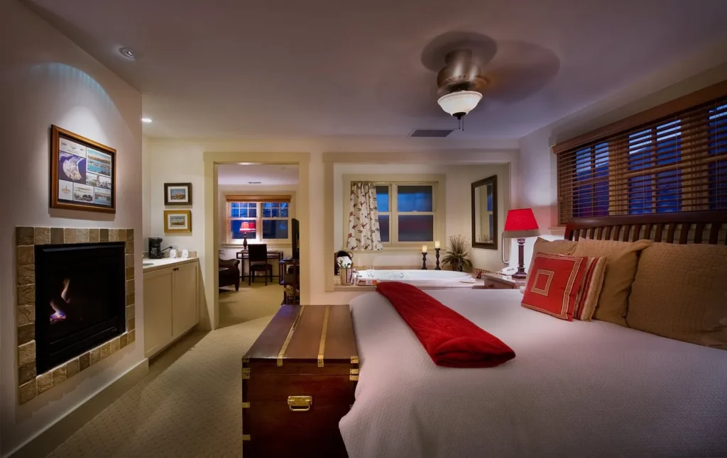 bedroom at 1906 Lodge in Coronado CA with a comfy bed and in-room hot tub for a relaxing California stay