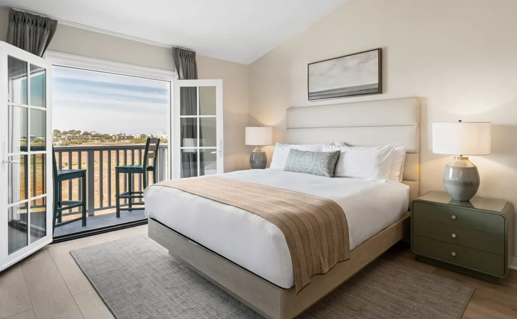 bedroom with one bed and private balcony at Inn at Playa del Rey, a top California hotel with hot tub in room