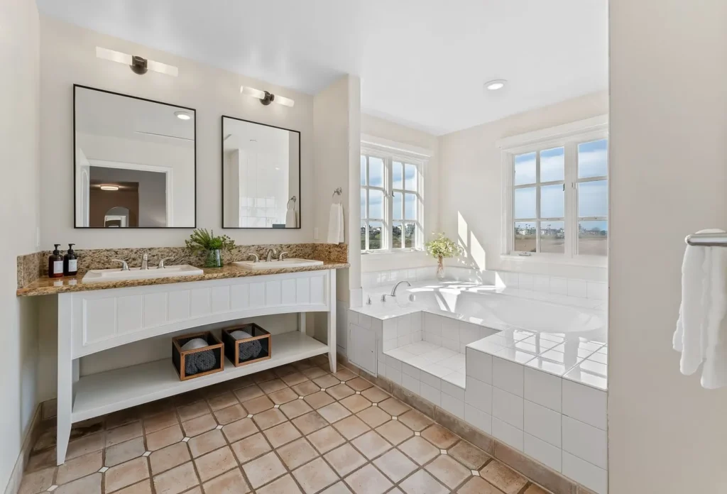 cozy bathroom featuring a hot tub and sink, captured at Inn at Playa del Rey in California